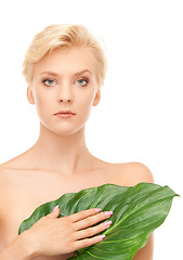 Image showing woman with green leaf