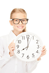 Image showing girl holding big clock