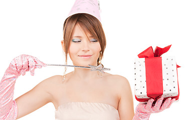 Image showing teenage party girl with magic wand and gift box
