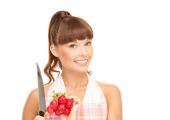 Image showing housewife with big knife and radish