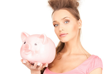 Image showing lovely woman with piggy bank