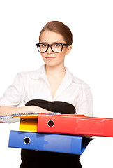 Image showing young attractive businesswoman with folders 