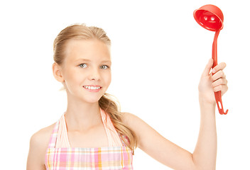 Image showing little housewife with red ladle