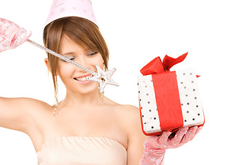 Image showing teenage party girl with magic wand and gift box