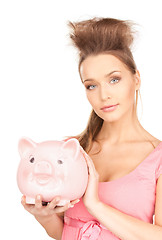 Image showing lovely woman with piggy bank