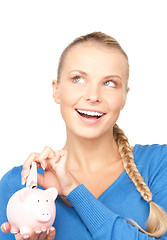 Image showing lovely woman with piggy bank and money