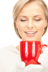 Image showing beautiful woman with red mug