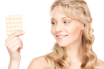 Image showing young woman with pills