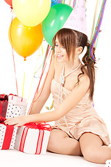 Image showing party girl with balloons and gift box