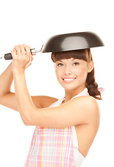 Image showing housewife with frying pan