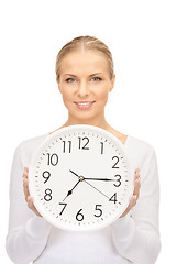 Image showing woman holding big clock