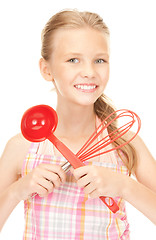 Image showing little housewife with red ladle