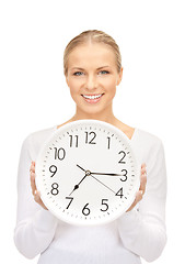 Image showing woman holding big clock