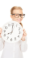 Image showing girl holding big clock