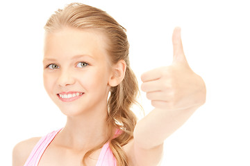 Image showing lovely girl showing thumbs up sign