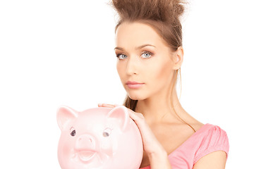 Image showing lovely woman with piggy bank