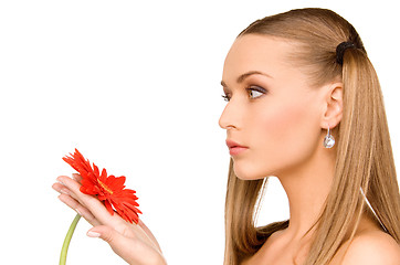 Image showing woman in towel with red flower