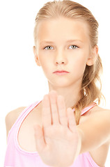 Image showing lovely girl showing stop sign