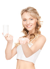 Image showing young woman with pills