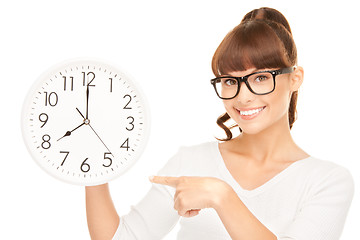 Image showing woman holding big clock