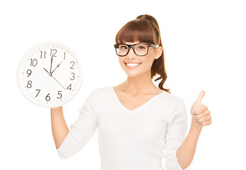 Image showing woman holding big clock