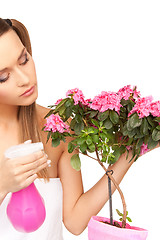 Image showing lovely housewife with flowers