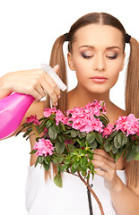 Image showing lovely housewife with flowers