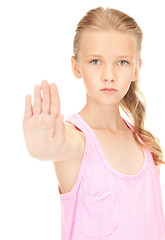 Image showing lovely girl showing stop sign