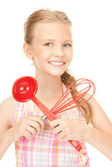 Image showing little housewife with red ladle