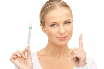 Image showing attractive female doctor with thermometer