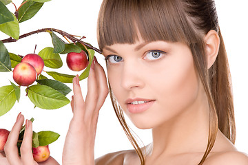 Image showing lovely woman with apple twig