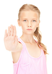 Image showing lovely girl showing stop sign