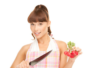 Image showing housewife with big knife and radish