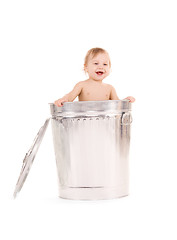 Image showing baby in trash can