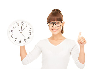 Image showing woman holding big clock