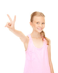 Image showing lovely girl showing victory sign