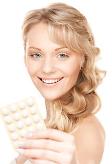 Image showing young woman with pills