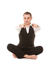 Image showing businessman sitting in lotus pose