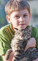 Image showing Little boy with cat