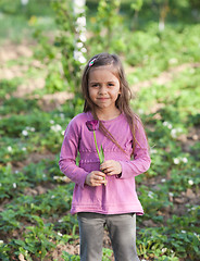 Image showing Little girl with flower