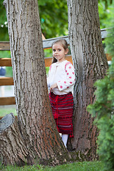 Image showing Cute little girl among the trees