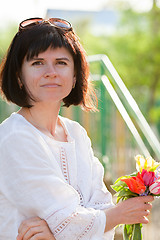 Image showing Woman with flowers