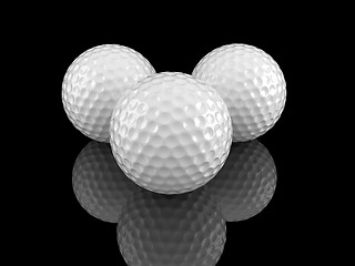 Image showing White golf balls with ground reflection