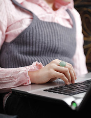 Image showing Young woman working on laptop