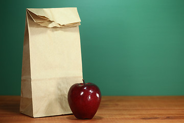 Image showing School Lunch Sack Sitting on Teacher Desk