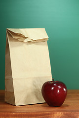 Image showing School Lunch Sack Sitting on Teacher Desk