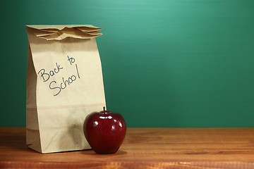 Image showing School Lunch Sack Sitting on Teacher Desk