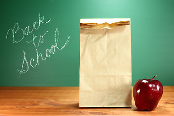 Image showing School Lunch Sack Sitting on Teacher Desk