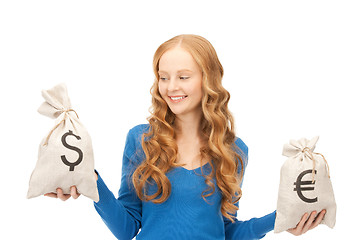 Image showing woman with euro and dollar bags