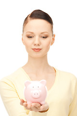 Image showing  lovely woman with piggy bank	 